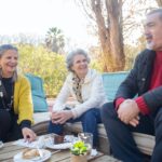 People Sitting on Couch outdoors While Having Tea